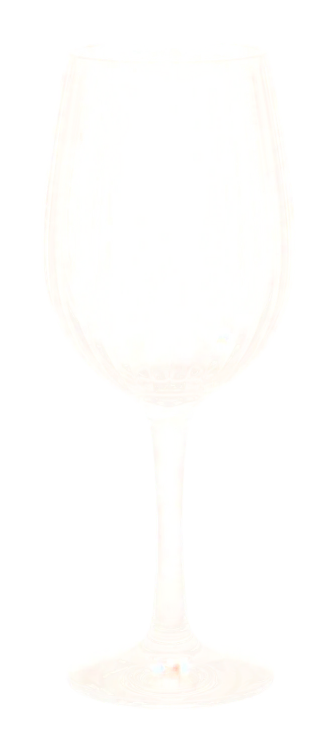 Prime wine glass in front of an aircraft window at dusk